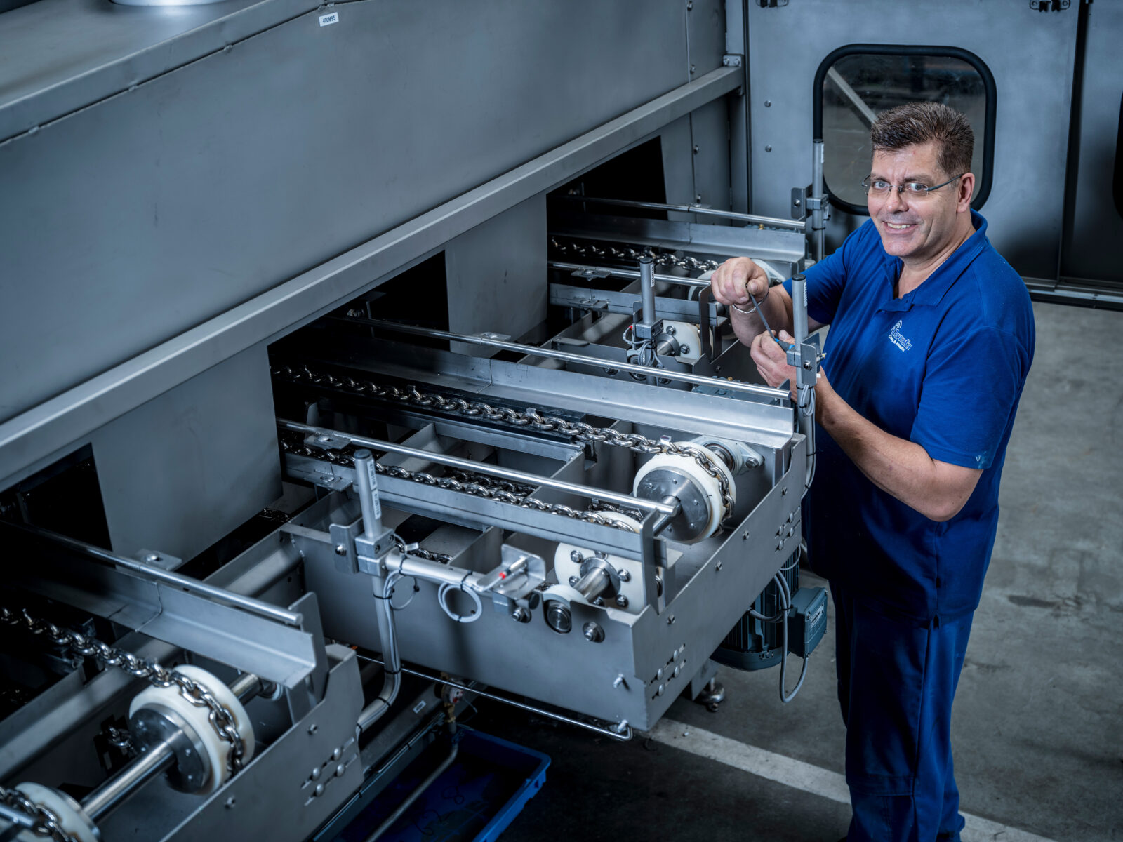 Numafa Employee working on machine